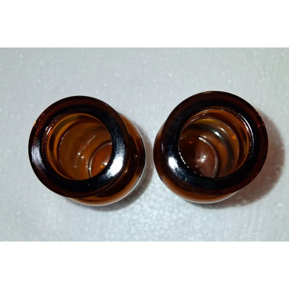 2 W Encircled Amber Glass Bottles 3 3/8